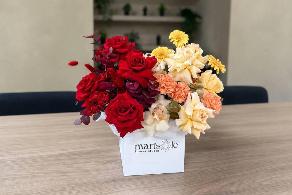 Rosh Hashanah flower arrangement in red, peach and gold in a Marisole Flower Studio box