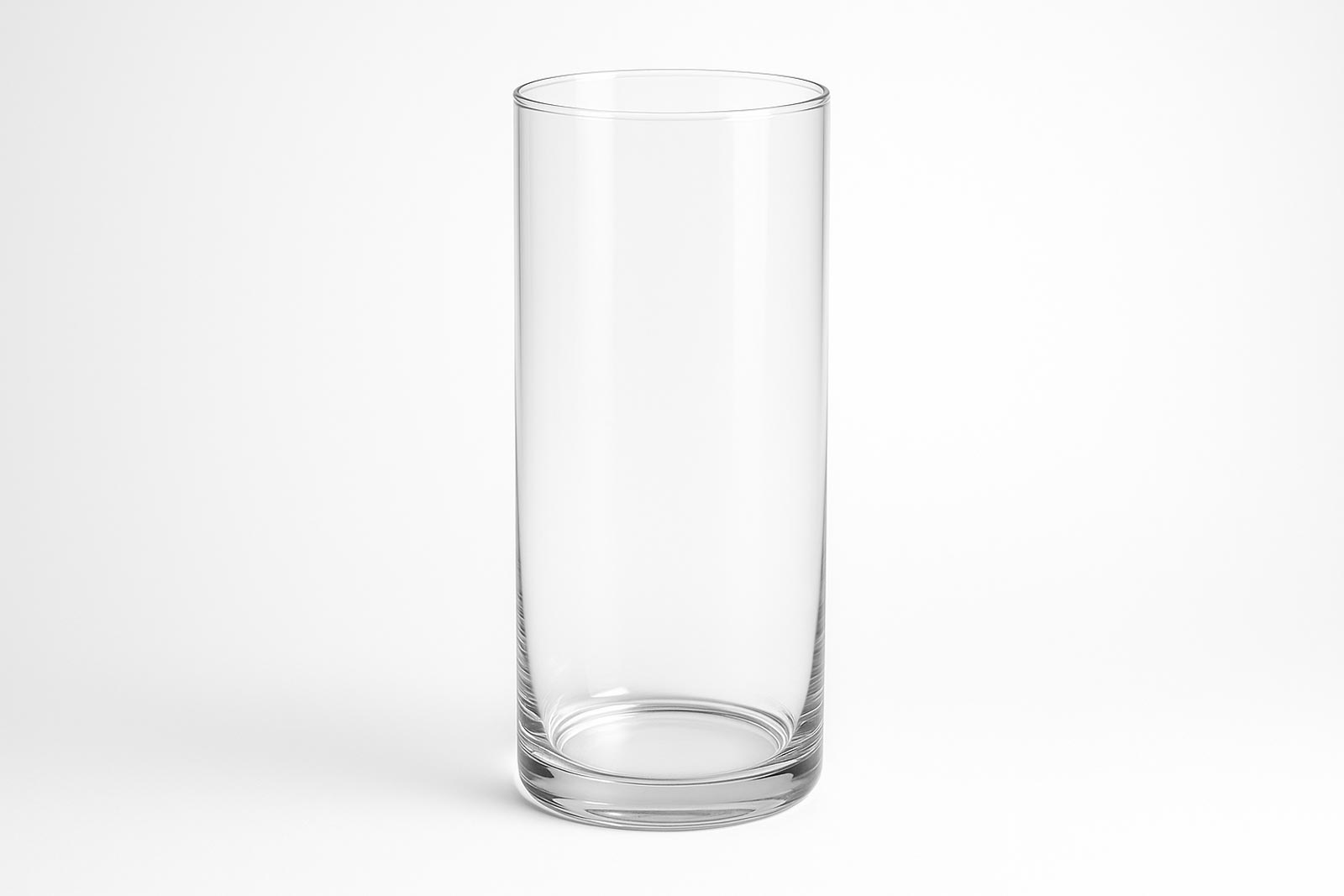 Clear cylindrical glass vase on a light background.