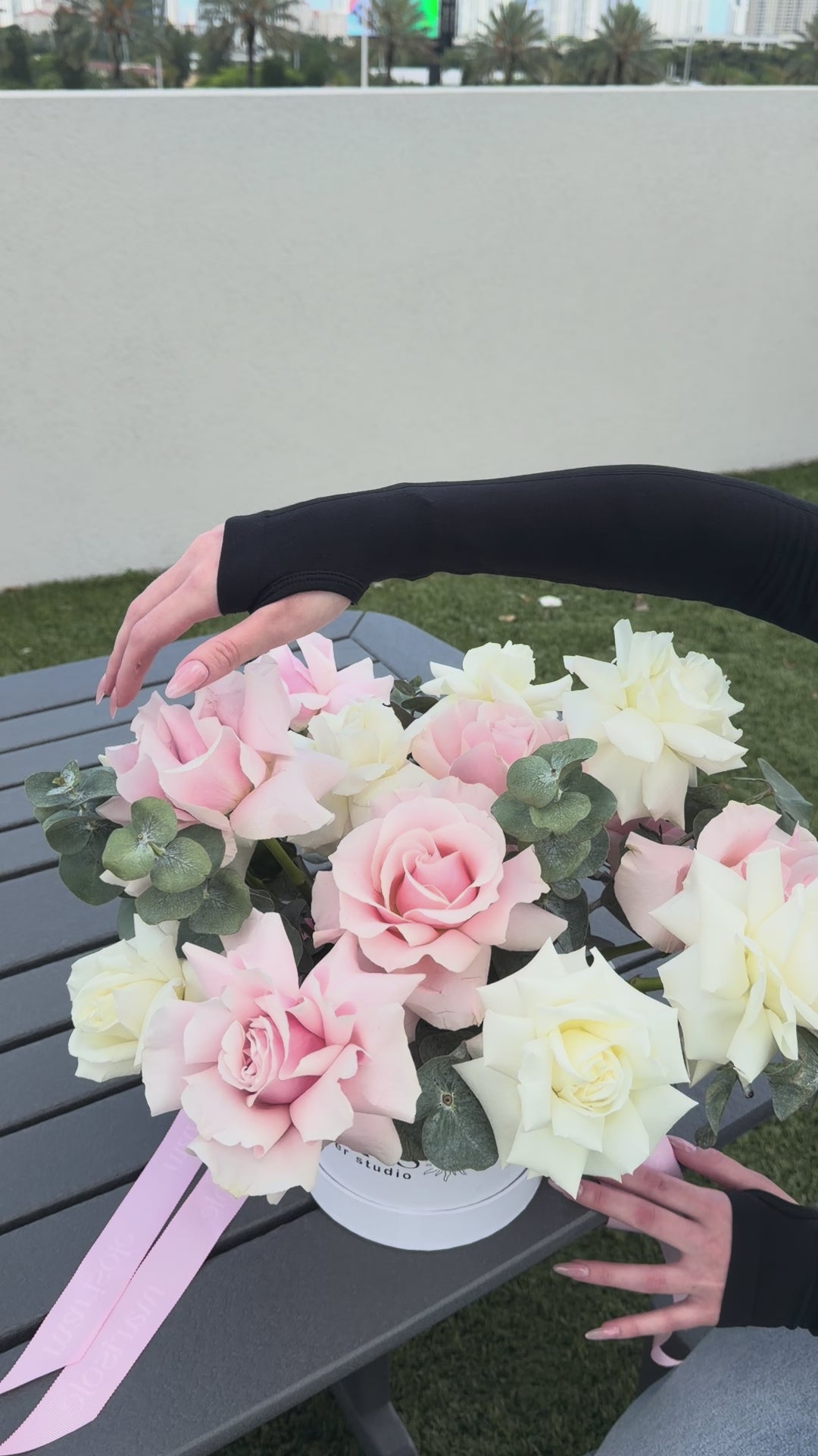 Video of the Pearl Bloom Box featuring blush and ivory French Roses and Eucalyptus in a Marisole Flower Studio box.