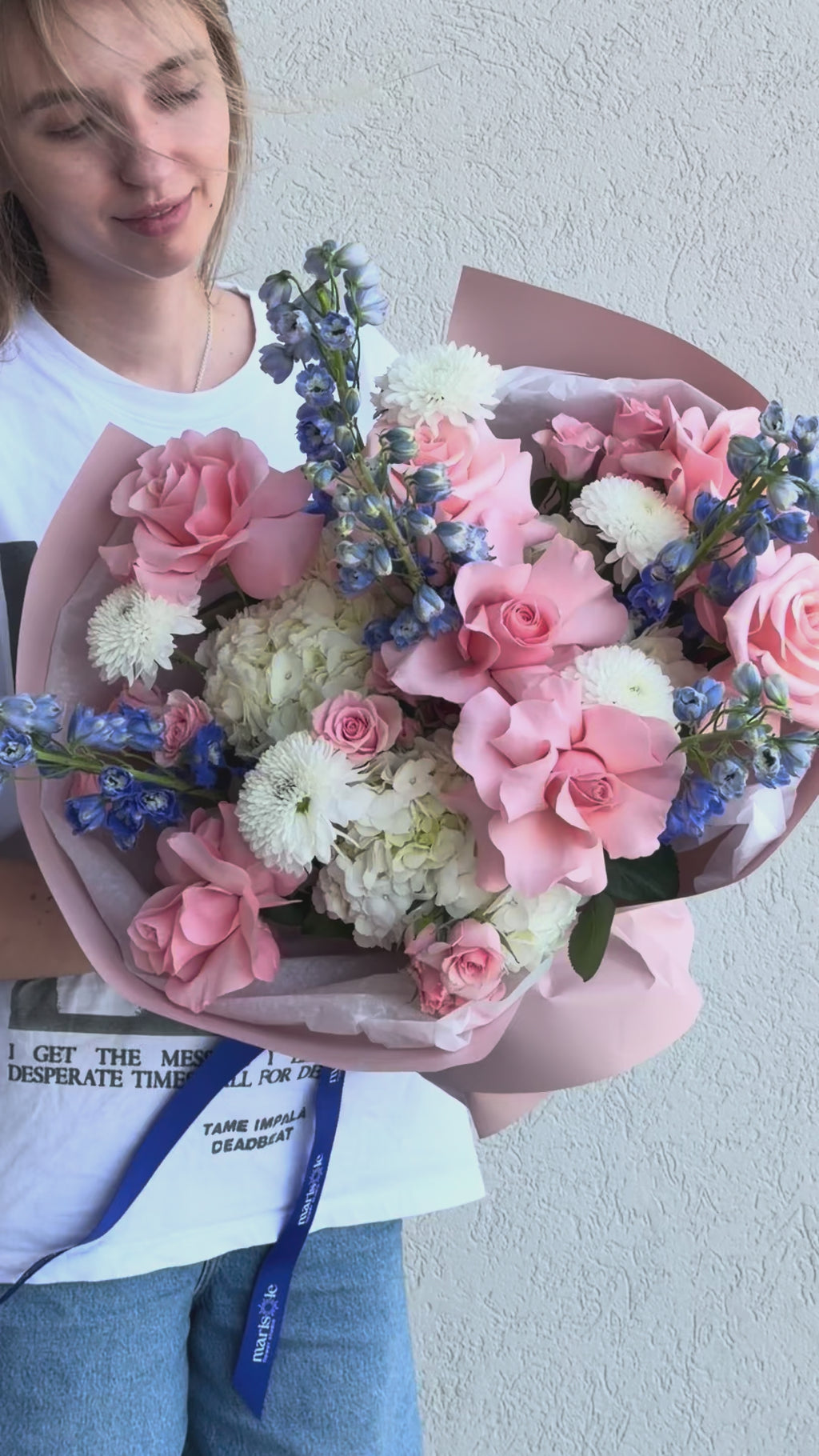 Video of Blush & Sky Bouquet showcasing hydrangea, French roses, delphinium, spray roses, and chrysanthemums from multiple angles.