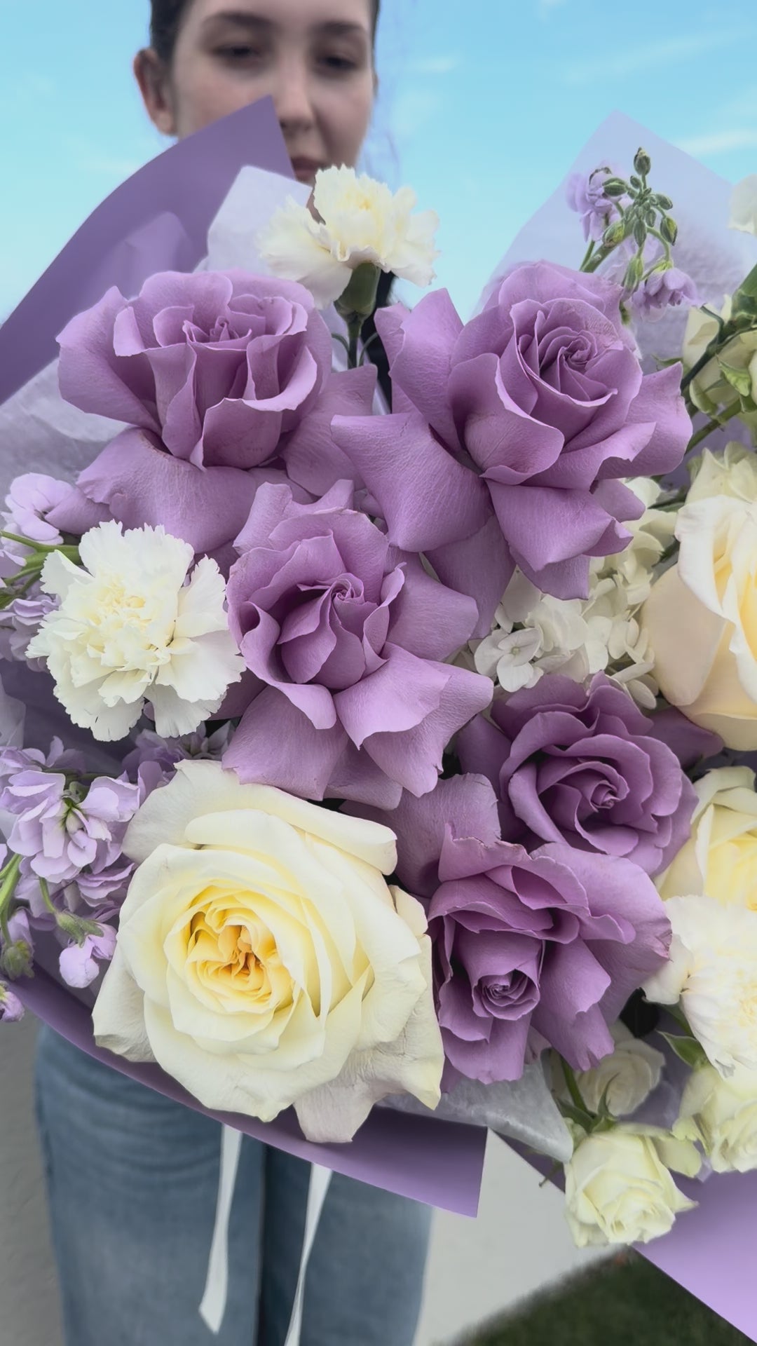 Video of the Purple Secret bouquet featuring lavender and ivory roses, hydrangea, spray roses, carnations, and stock.