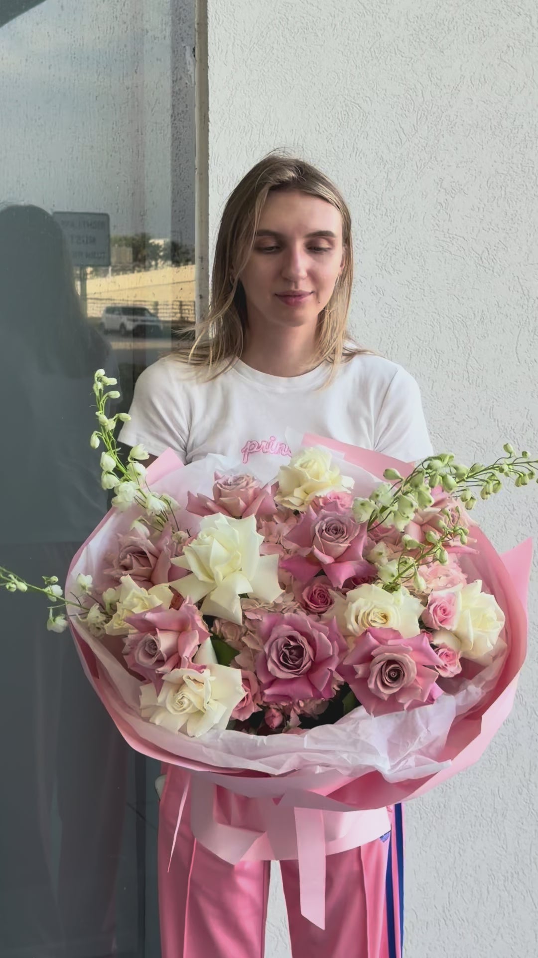 Video of the Pinky Promise Bouquet with French roses, spray roses, hydrangea, and delphinium
