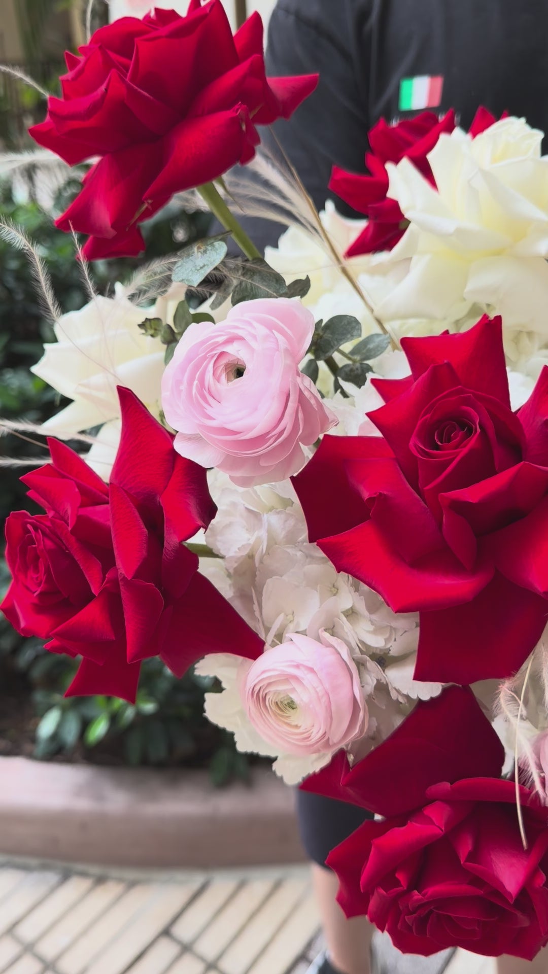Video of the Bordeaux & Blanc Box featuring red French Roses, white hydrangea, ranunculus, dry flowers, and eucalyptus.