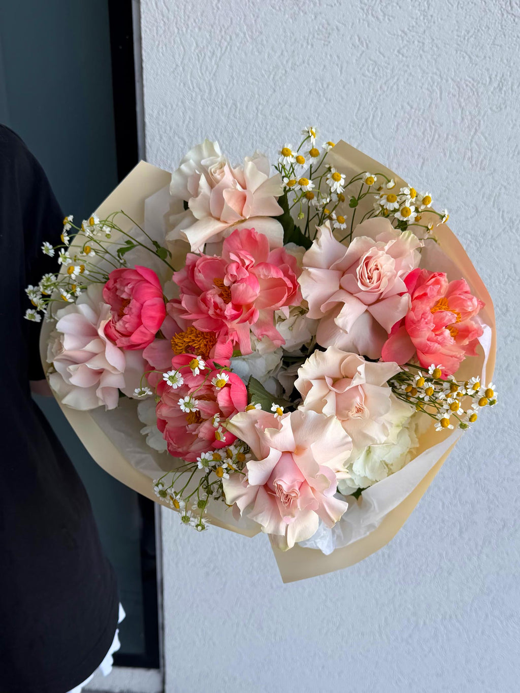 Bouquet of pink and white flowers with a light background