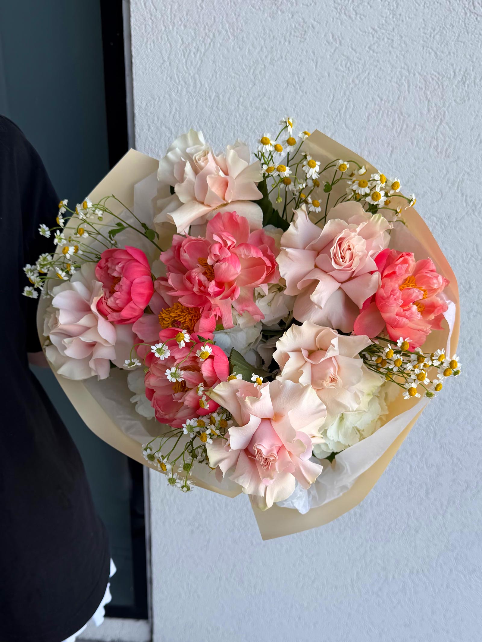 Bouquet of pink and white flowers with a light background